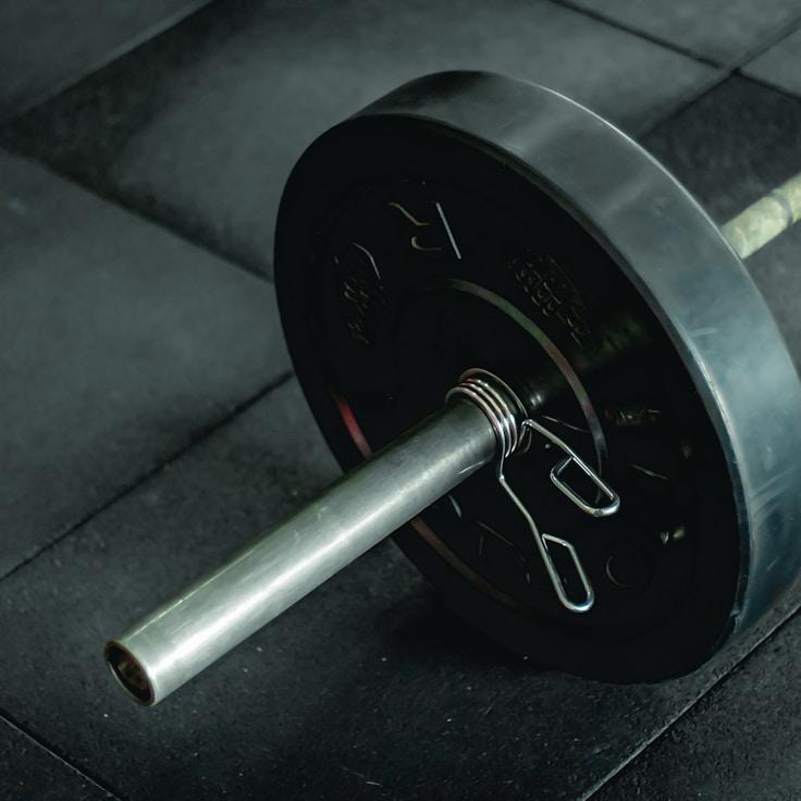 Interior of a professional gym with weight training equipment and mirrors